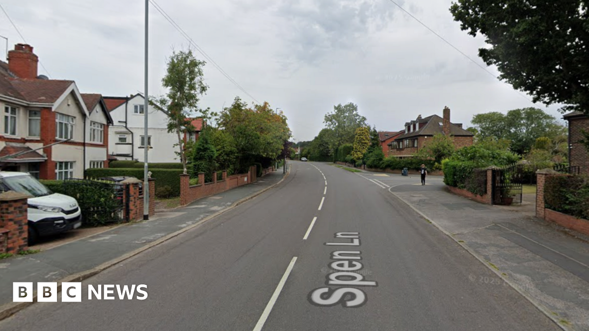 A suburban street with large detached houses