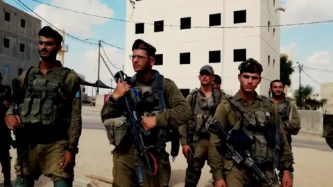 IDF Screengrab from Israel Defense Forces handout video showing soldiers from the Kfir Brigade