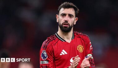 Bruno Fernandes applauding while wearing Manchester United match kit