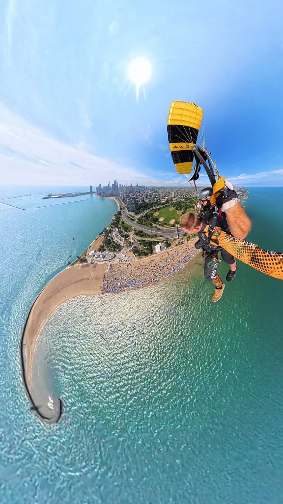 Victor Hilitski, freelance photojournalist for Block Club Chicago, tandem jumps over Chicago with the U.S. Army Golden Knights parachute team on Aug. 17, 2025.