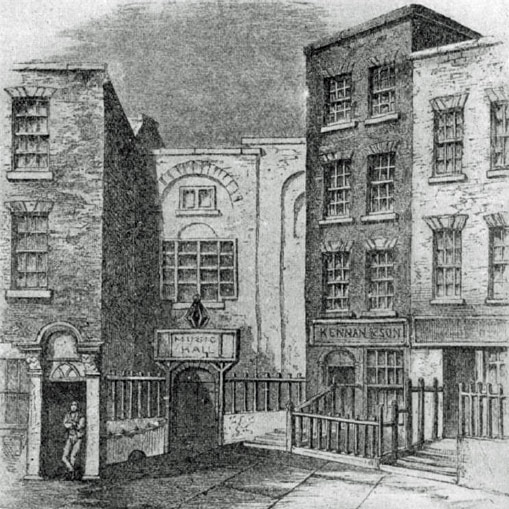 A black and white sketch of brick buildings with iron fences along an old city street.