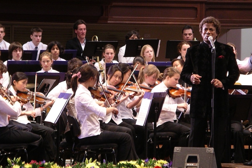 Kamahl performing with orchestra