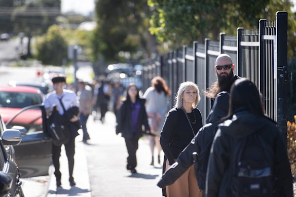 Staff and students arriving at Keysborough Secondary College on Wednesday morning.
