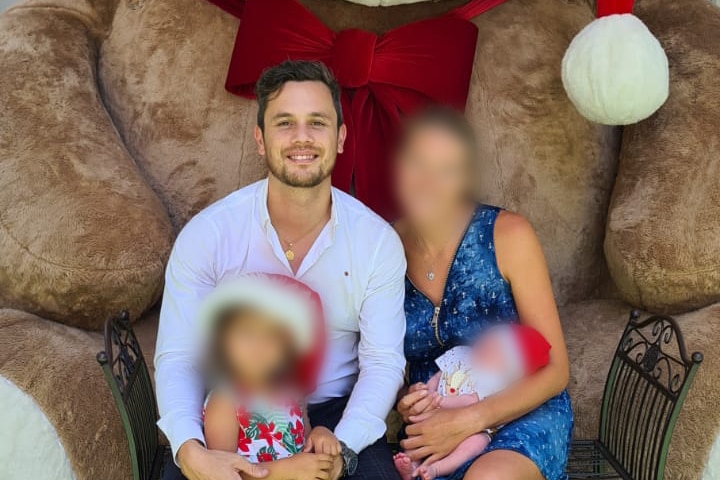 Cubis with a woman and two children in front of a giant teddy bear.