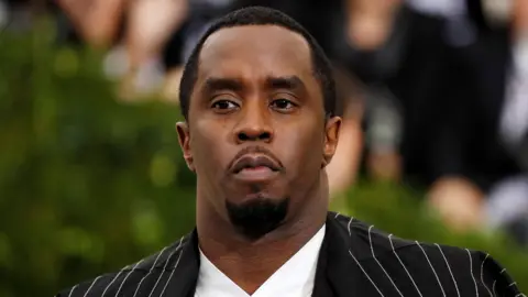Reuters Sean Combs in a black suit with white stripes at the 2017 Met Gala