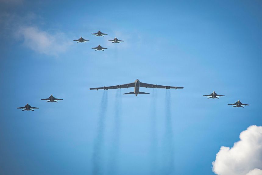 Eight F/A-18E/F Super Hornets, assigned to Strike Fighter Squadrons 31, 37, 87, and 213 from embarked Carrier Air Wing Eight aboard USS Gerald R. Ford, and a US Air Force B-52 Stratofortress operate as a joint force on November 13.