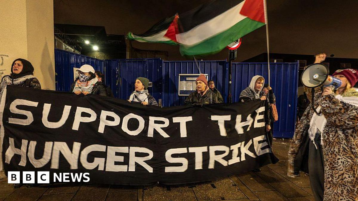 A protest outside a prison in support of prisoners on hunger strike over Palestine-related causes