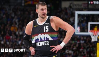 Nikola Jokic stood with his hands on his hips while playing for the Denver Nuggets