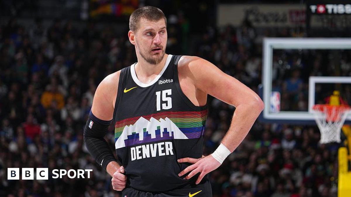 Nikola Jokic stood with his hands on his hips while playing for the Denver Nuggets