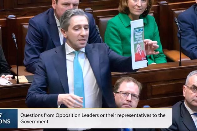 ‘Pantomime’ erupts in Dail as Simon Harris holds up graphic of Michelle O’Neill