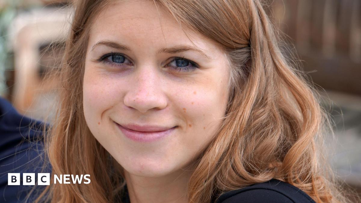A close-up photograph of Sarah Everard, a young woman with brown hair, smiling at the camera.