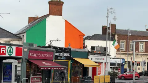 BBC Irish tricolour painted on a gable wall 