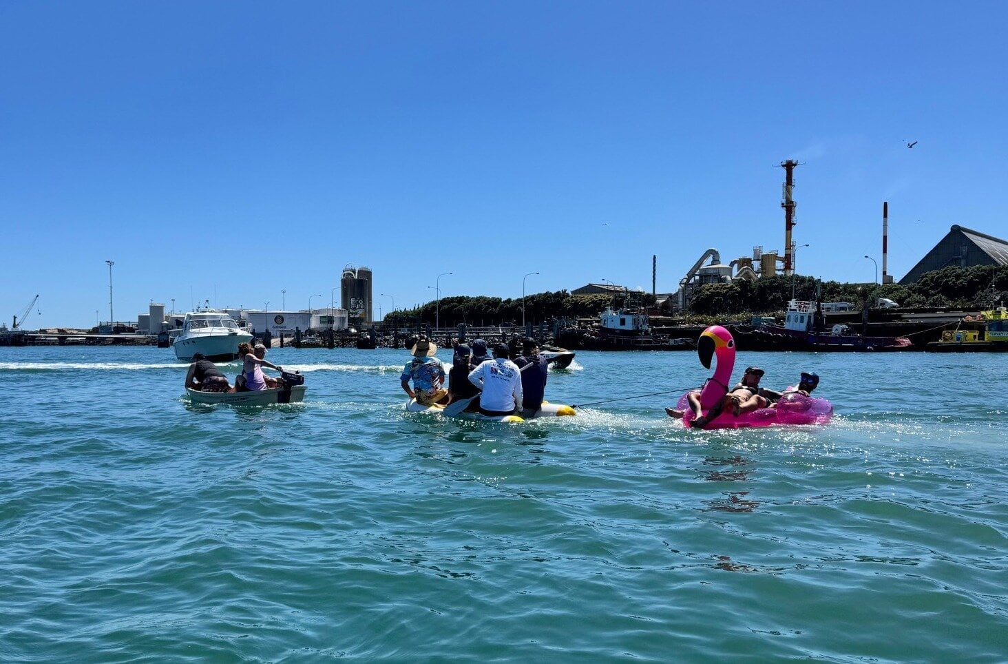 Mount Maunganui Yacht Club members enjoying some Christmas party fun near the sandbar in Tauranga Harbour. 