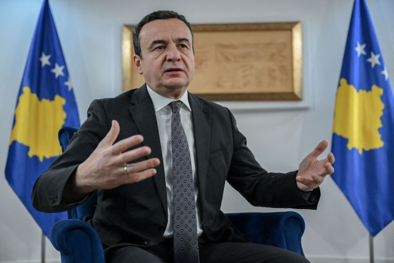 Kosovo's acting Prime Minister and leader of the Vetevendosje (LVV) party, Albin Kurti, gestures as he speaks during an interview with AFP in Pristina on December 24, 2025. Kosovo and Serbia "need to normalise" their relationship, the acting Prime Minister of Kosovo told AFP in an interview just days before legislative elections in which he will put his mandate on the line.