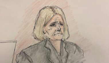 A courtroom sketch of a woman with short blonde hair wearing a dark blazer, looking serious.