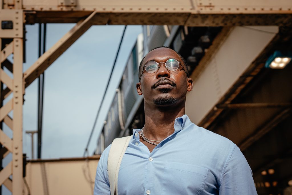 Walter Redmond Burnett stands for a portrait beneath the Lake Street el tracks in the West Loop neighborhood of Chicago on July 11, 2025. His father, Walter Burnett, Chicago’s longest-tenured alderman and current vice mayor, recently announced he will resign at the end of July; Walter Redmond Burnett is widely expected to be considered for the appointment to replace him.