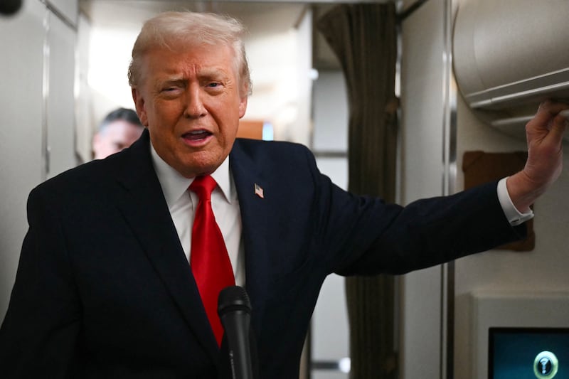 US president Donald Trump speaks to the media aboard Air Force One on December 9, 2025, en route to deliver remarks in Pennsylvania. Photograph: Andrew Caballero-Reynolds/ AFP via Getty Images