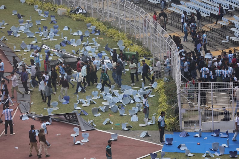 Fans throw bottles and chairs and vandalise hoardings at Salt Lake Stadium in Kolkata, West Bengal, India. Photograph: Piyal Adhikary/EPA
