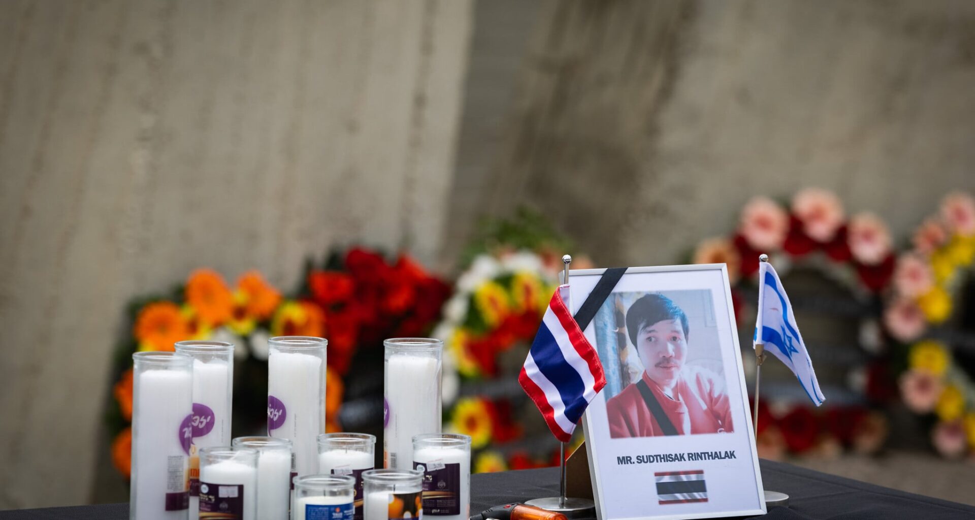 'One of ours': Officials bid farewell to Sudthisak Rinthalak as his body flown home