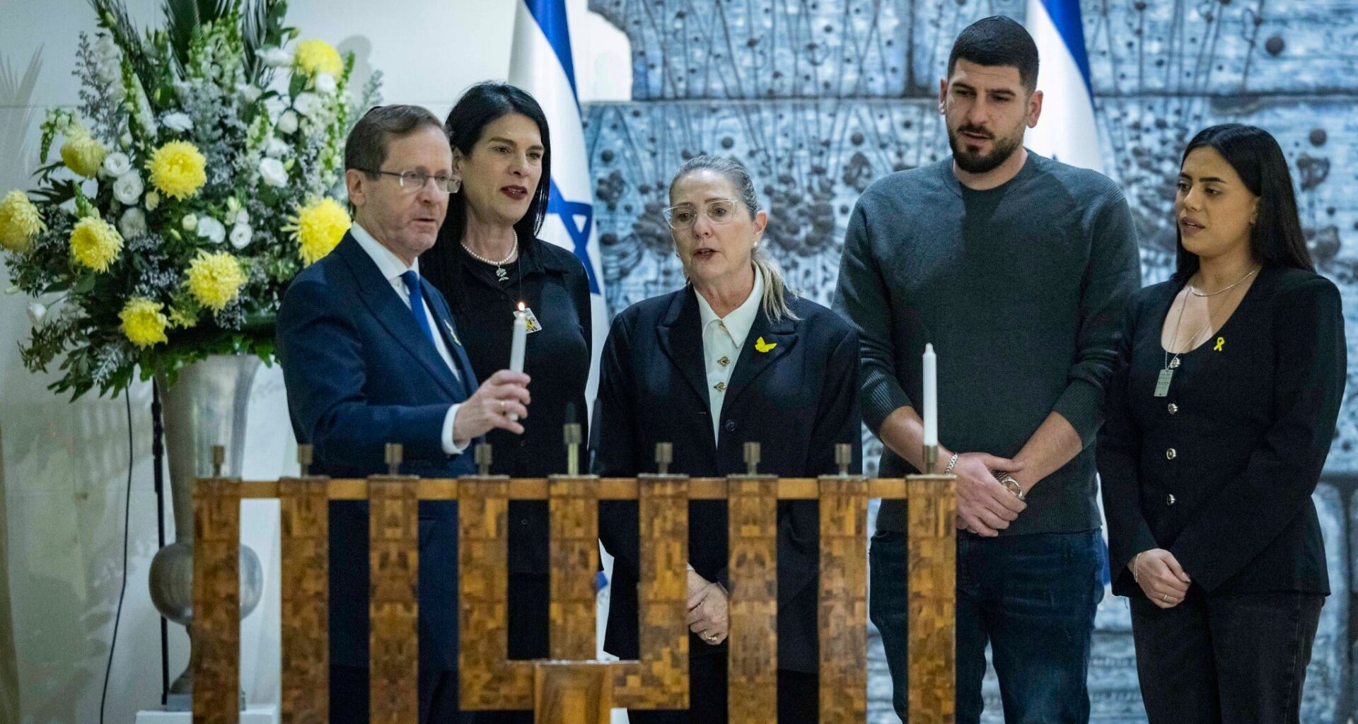 Candle lightings nationwide on Hanukkah's first night honor final hostage Ran Gvili
