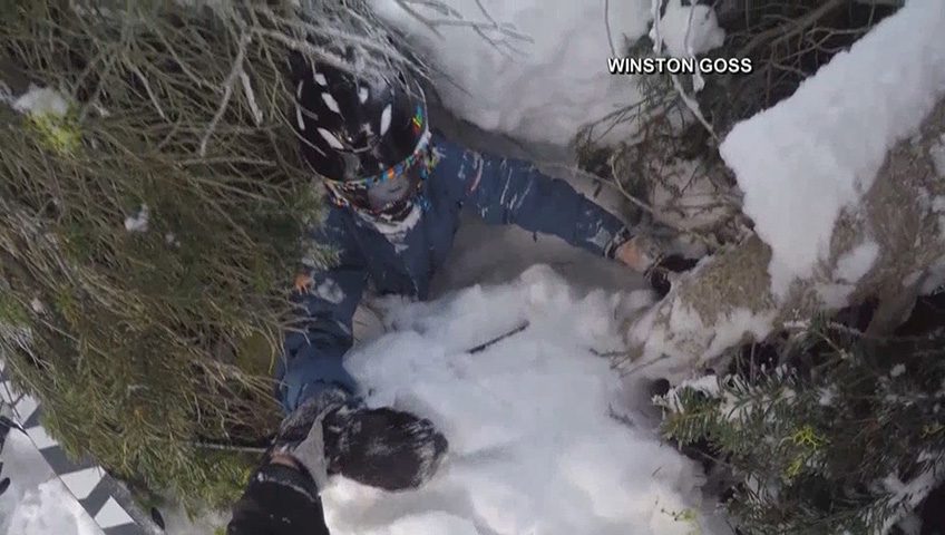 Click to play video: 'Father rescues son buried in tree well snow'