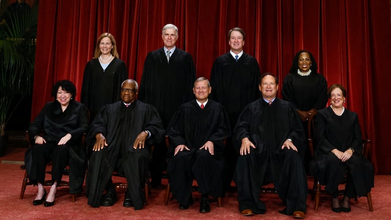 U.S. Supreme Court justices Amy Coney Barrett, Neil Gorsuch, Brett Kavanaugh, Ketanji Brown Jackson, Sonia Sotomayor, Clarence Thomas, Chief Justice John Roberts, Jr., Samuel Alito and Elena Kagan pose for a group portrait in Washington, D.C. on October 7, 2022.