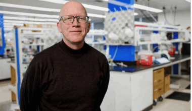 Stephen Betz in his lab posing for a photo.