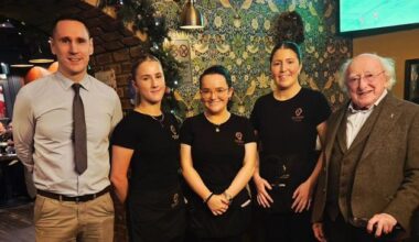Michael D Higgins visits Galway pub posing for photo with delighted staff