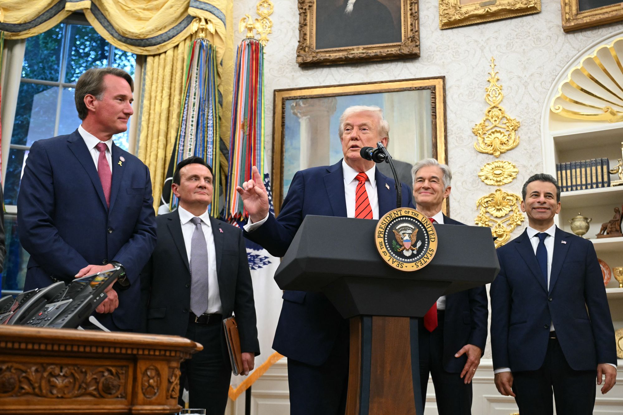 Trump could considered term-limited Virginia Governor Glenn Youngkin, left, who will leave office in January, for any potential cabinet openings, according to reports.
