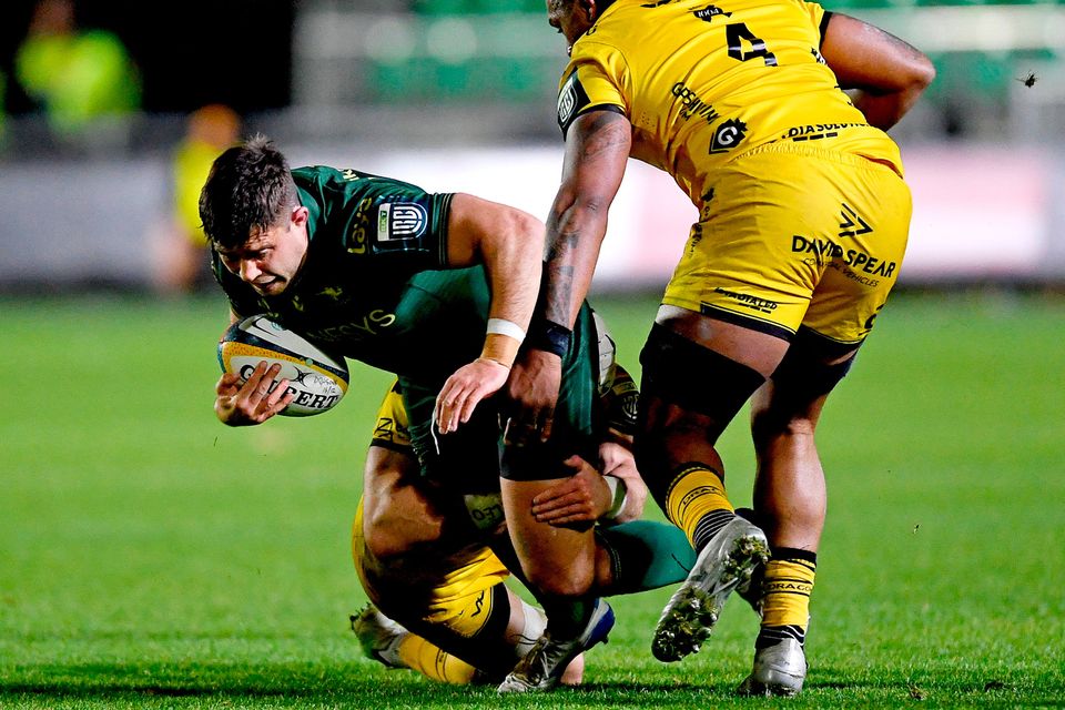 Dave Heffernan of Connacht is tackled by Levi Davies of Dragons during the United Rugby Championship match at Rodney Parade in Newport, Wales. Photo: Kian Abdullah/Sportsfile
