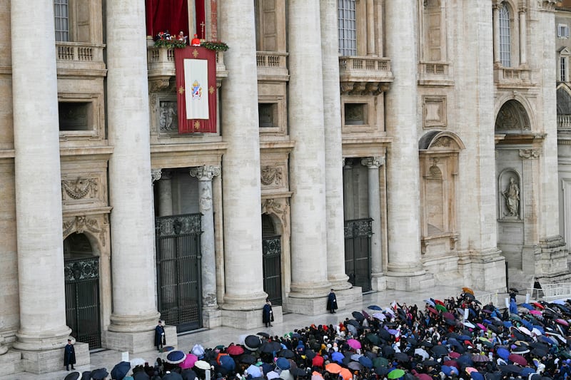 The faithfull look at Pope Leo speaking from the main balcony of St Peter's basilica on 
Christmas day. Photograph: Andreas Solaro/AFP via Getty