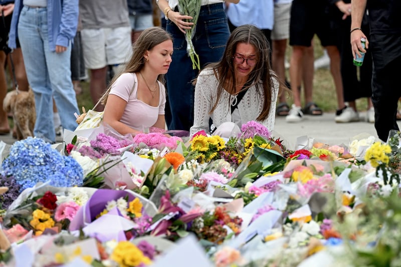 Mourners pay a floral tribute to Bondi Beach shooting victims at the Bondi Pavillion in Sydney. Photograph: Saeed KHAN / AFP via Getty Images