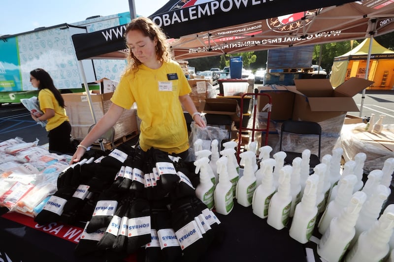 Latter-day Saint volunteers helping distribute supplies to Southern California wildfire survivors at the Multi-Agency Resource Center hosted at the Pasadena California Stake Center on May 14, 2025.