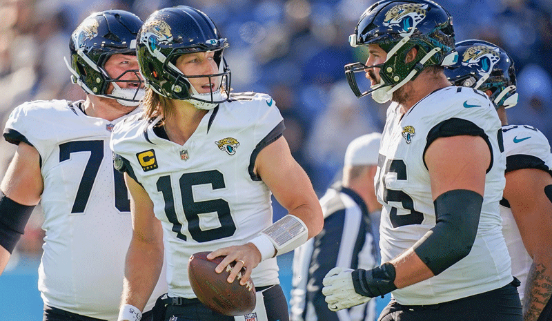 Jacksonville Jaguars quarterback Trevor Lawrence (16) gets up after running in a two point conversion against the Tennessee Titans
