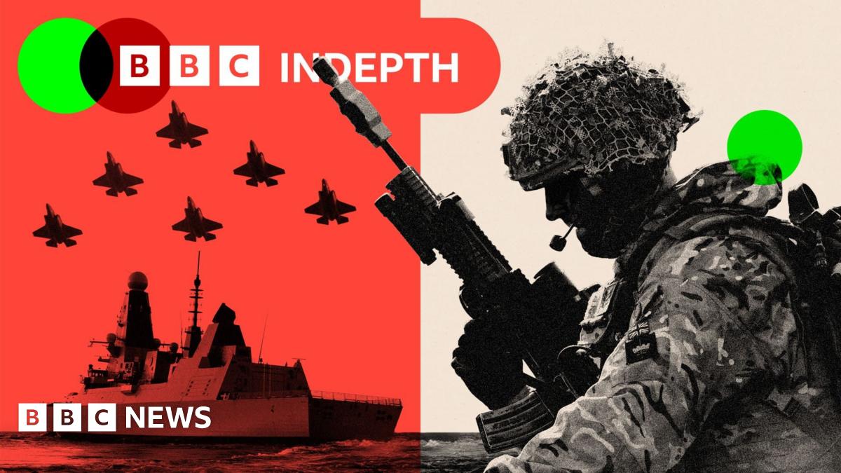 A UK soldier in a cloud of orange smoke in a simulated attack