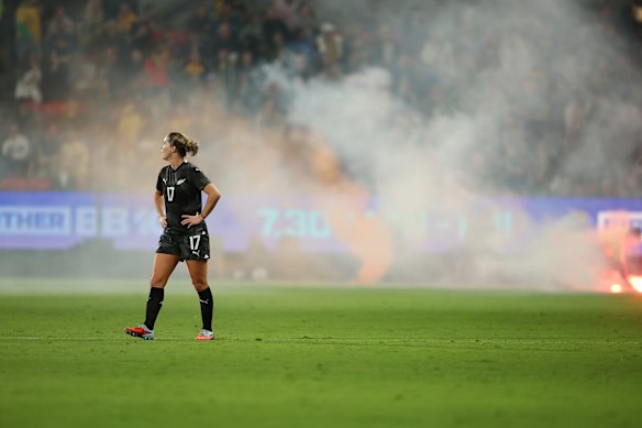 A flare is set off during the match.