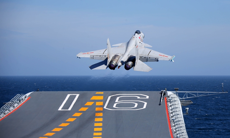 A J-15 carrier-borne fighter jet takes off from the flight deck of the aircraft carrier Liaoning during a maritime training exercise on July 1, 2017. The Chinese aircraft carrier Liaoning and its carrier strike group carried out realistic training in an undisclosed sea area on July 1, 2017. (eng.chinamil.com.cn/Photo by Li Tang)