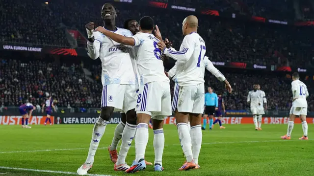 : Youri Tielemans of Aston Villa celebrates scoring his team's second goal with teammate Amadou Onana during the UEFA Europa League 2025/26 League Phase MD6 match between FC Basel 1893 and Aston Villa FC at St. Jakob-Park
