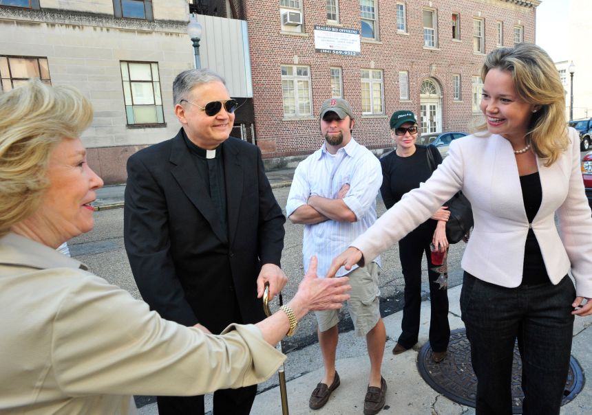 Political newcomer Helena Moreno (right) reaches out on November 4, 2008, to Nanette Shapiro and Father Stan Klores before voting in New Orleans. She is running to unseat indicted Rep. William Jefferson in Louisiana's 2nd Congressional District.