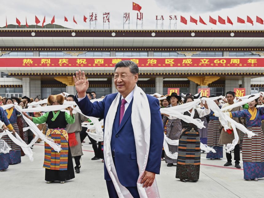 Chinese leader Xi Jinping waves as he arrives at Lhasa, Tibet for a rare visit to the region this past August.
