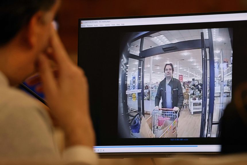 Brian Walshe watches security footage from at a HomeGoods store that was shown during his murder trial.