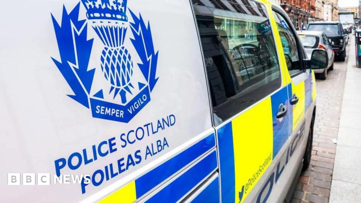 Police van with Police Scotland written on the side. There are also yellow and blue stickers on it.