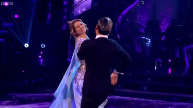 Karen and Carlos dancing Waltz in a light blue dress