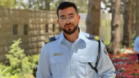 Handout Ran Gvili in his police officer's uniform - he was 24 at the time of the Hamas attack, on 7 October 2023