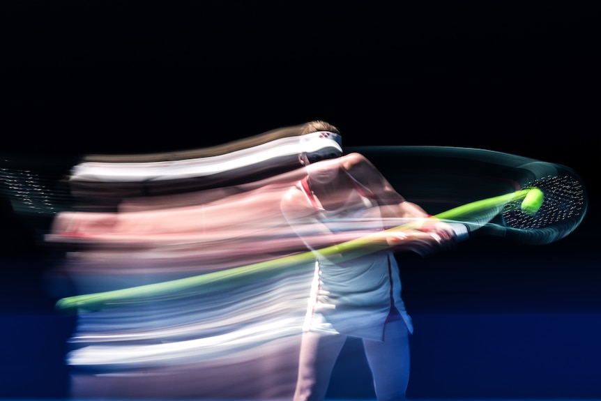 Dayana Yastremska hits a backhand, with an image of her trailing behind.