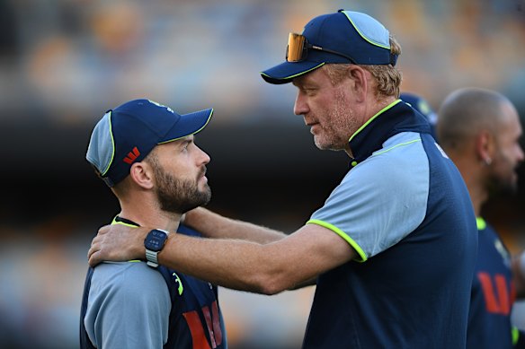Josh Inglis (left) talks with Australian coach Andrew McDonald.
