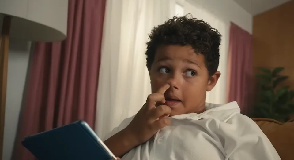 Dettol's ad showed a boy picking his nose and wiping it across his tablet, which many said depicted unhygienic behaviour. Photo: YouTube/Dettol Australia