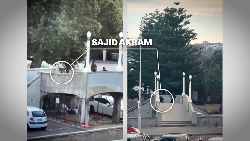 Sajid Akram can be seen on the bridge as the officer named as Detective Senior Constable Cesar Barazza takes aim from near a tree.