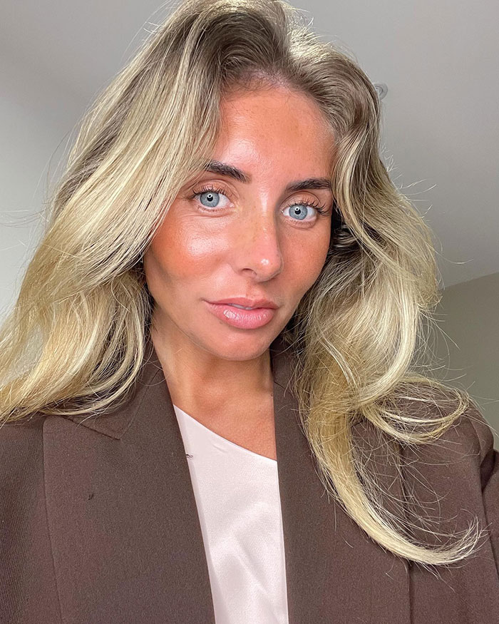 Woman with blonde hair wearing a brown blazer, representing the snitch who reported Bonnie Blue to cops facing prison.