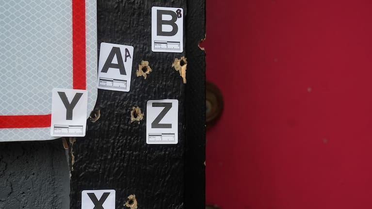 Bullet holes are shown where a mass shooting took place Saturday at a banquet hall in Stockton.